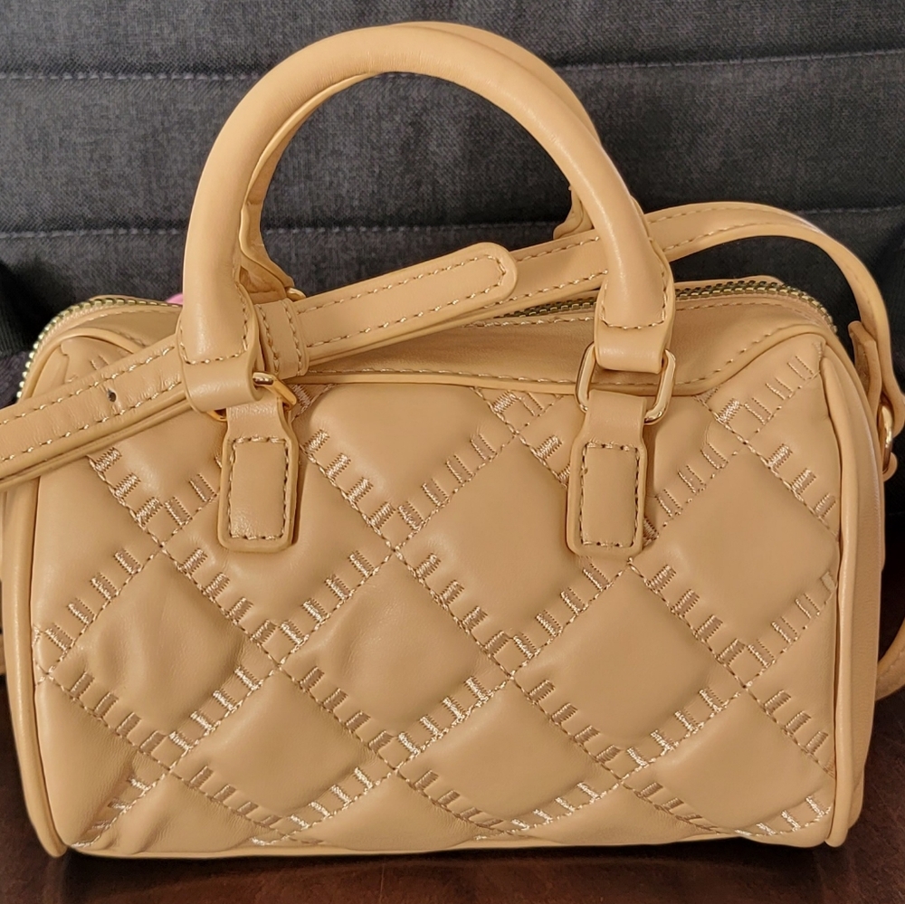 Small, cute, and eye catching mini purse.